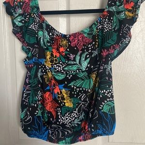 Black shirt with tropical flowers off the shoulders